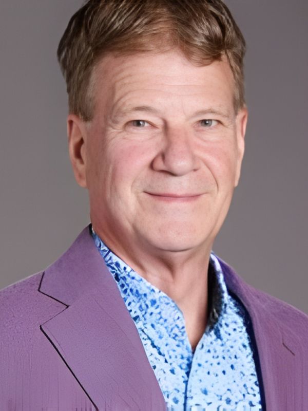 ron young headshot male wearing purple suit jacket and blue shirt